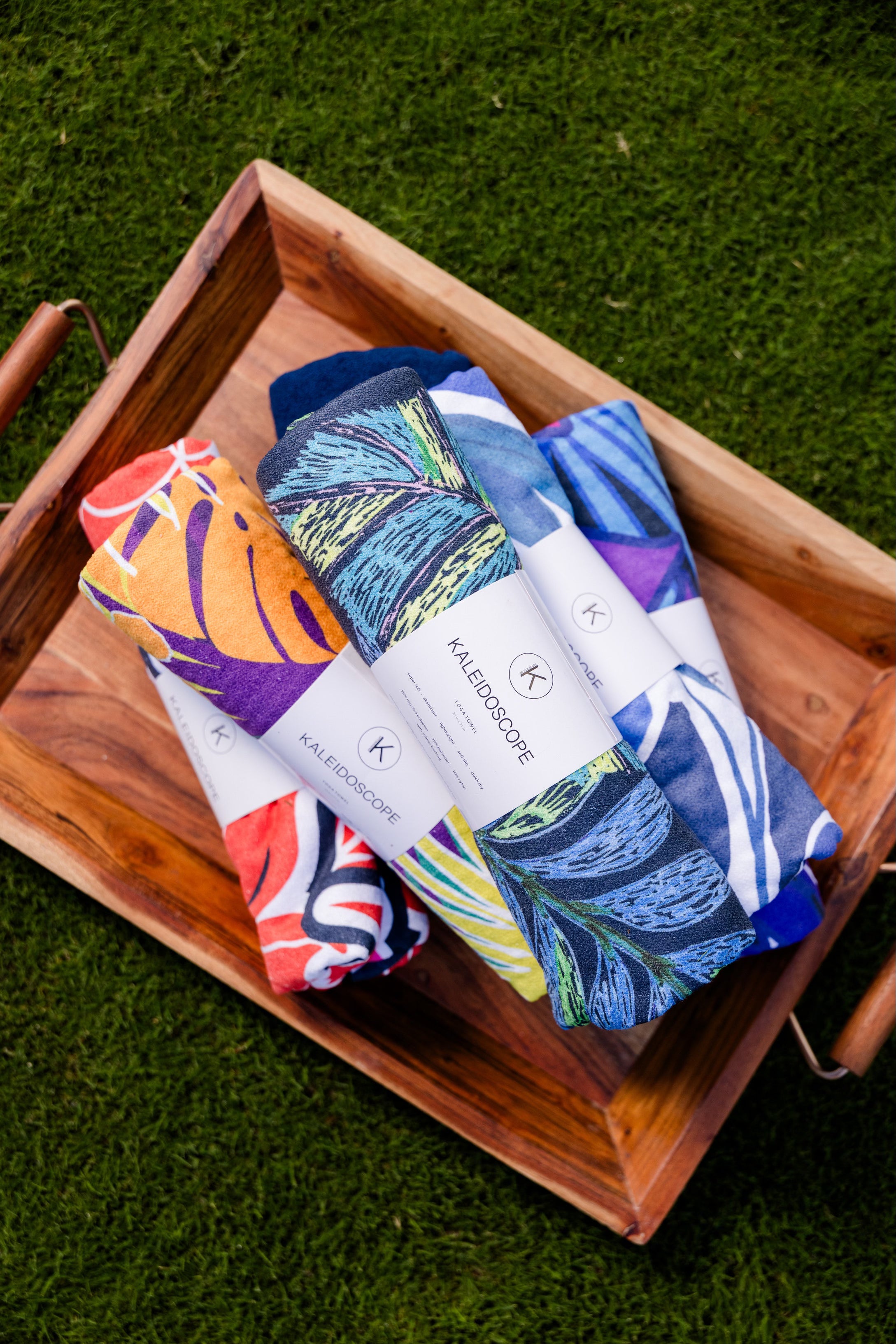 Kaleidoscope yoga towels in vibrant prints for men and women, perfect for hot yoga sessions