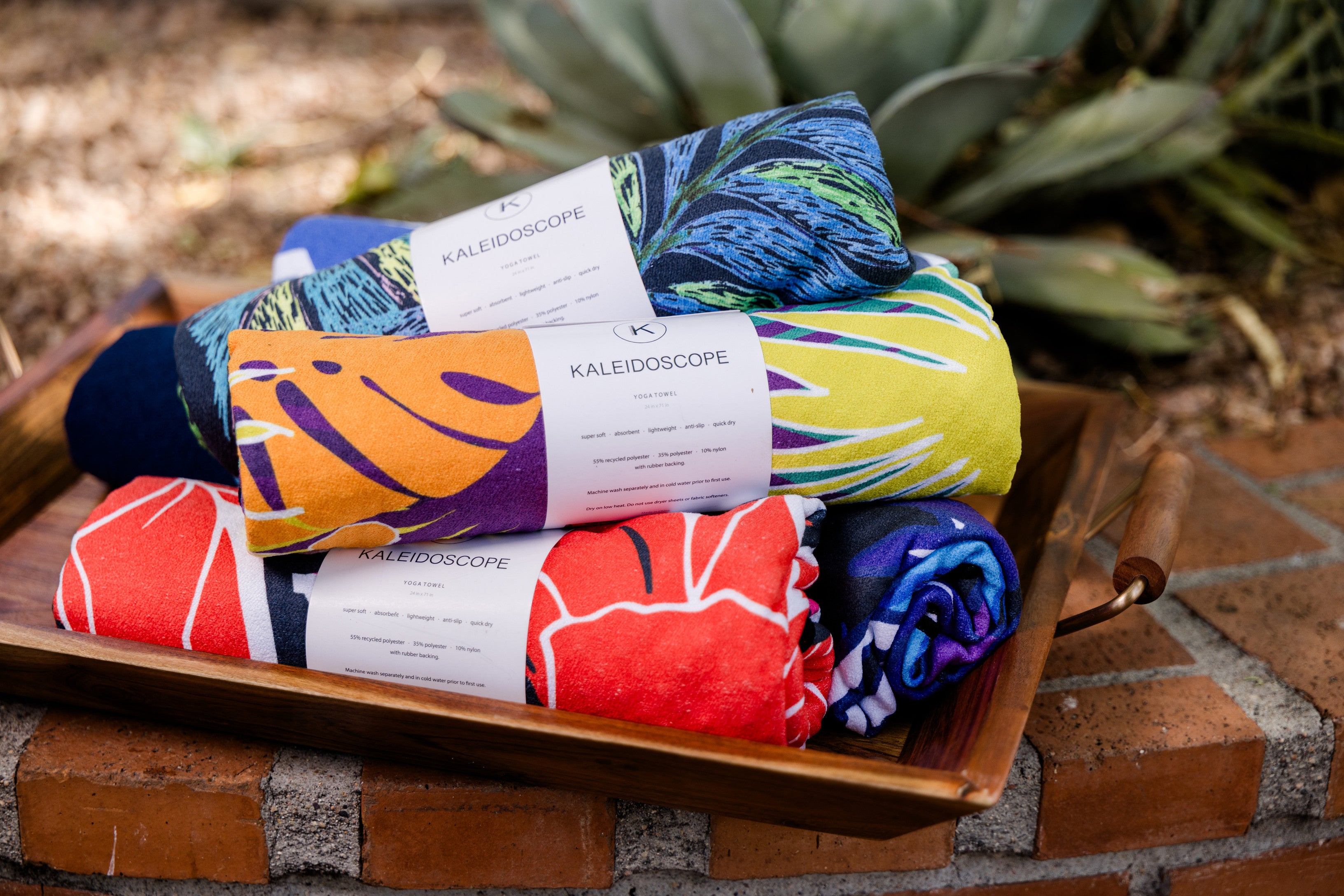 Kaleidoscope yoga towels in vibrant prints for men and women, perfect for hot yoga sessions