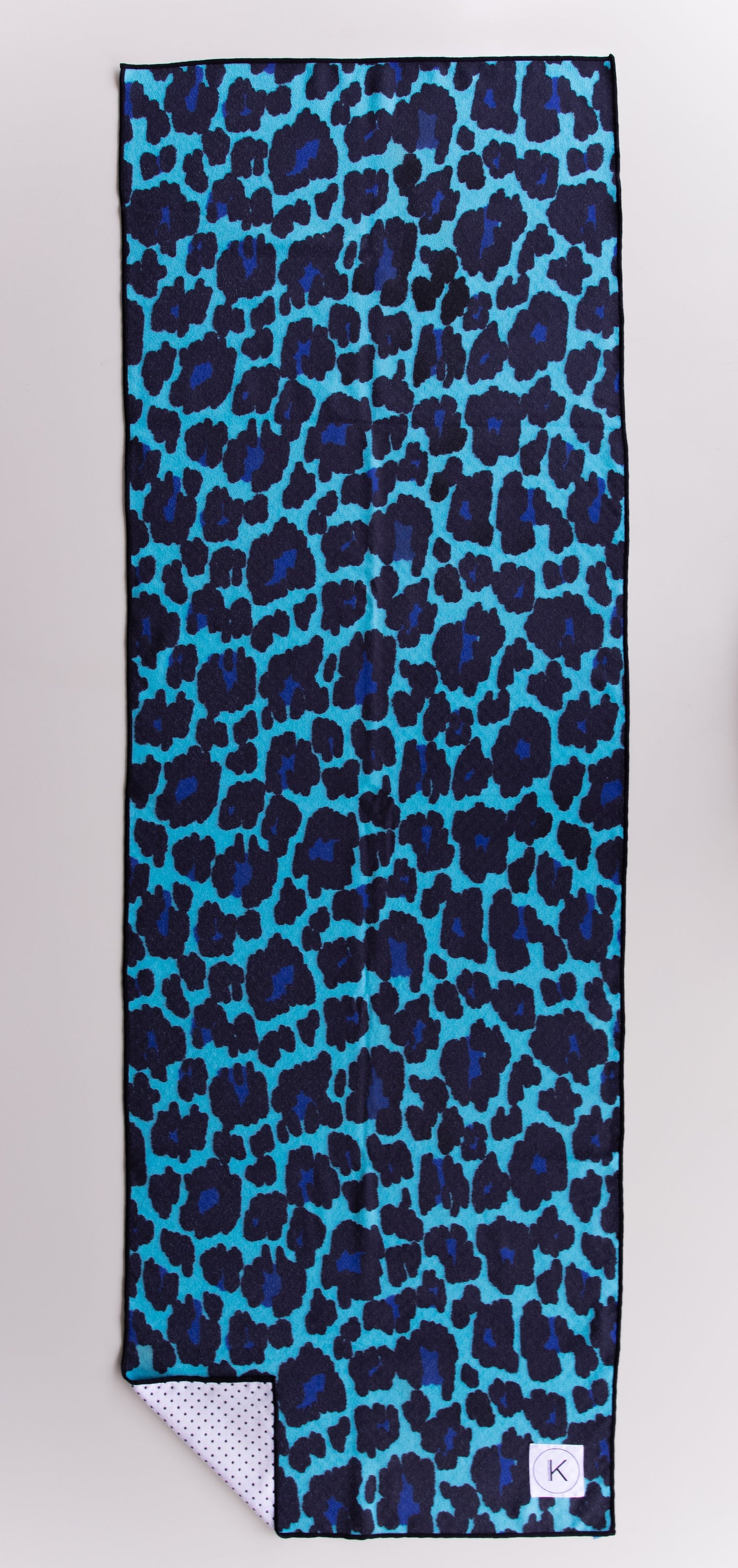 Kaleidoscope yoga towels in vibrant prints for men and women, perfect for hot yoga sessions