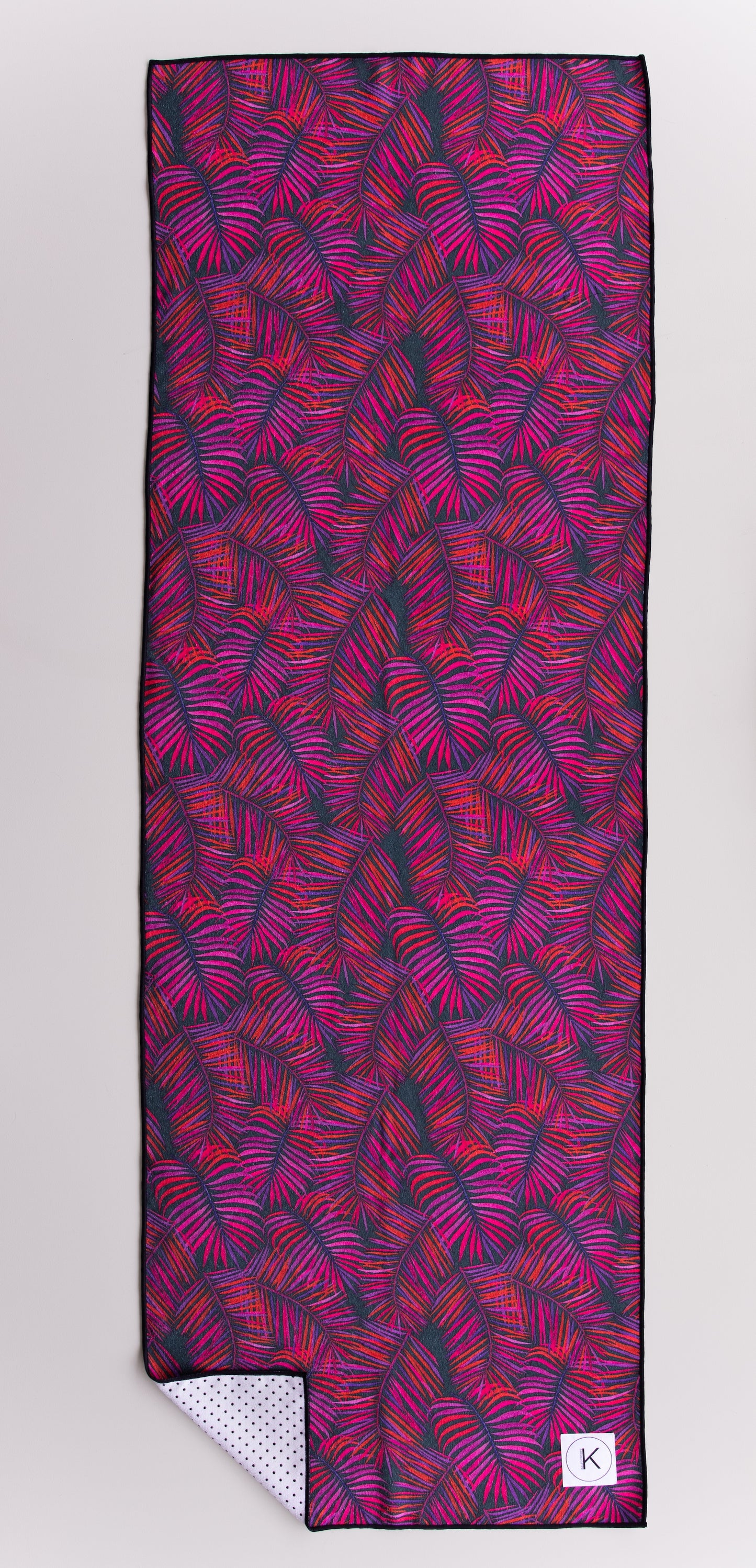 Eco-friendly kaleidoscope yoga towels with bold prints for men and women practicing hot yoga.