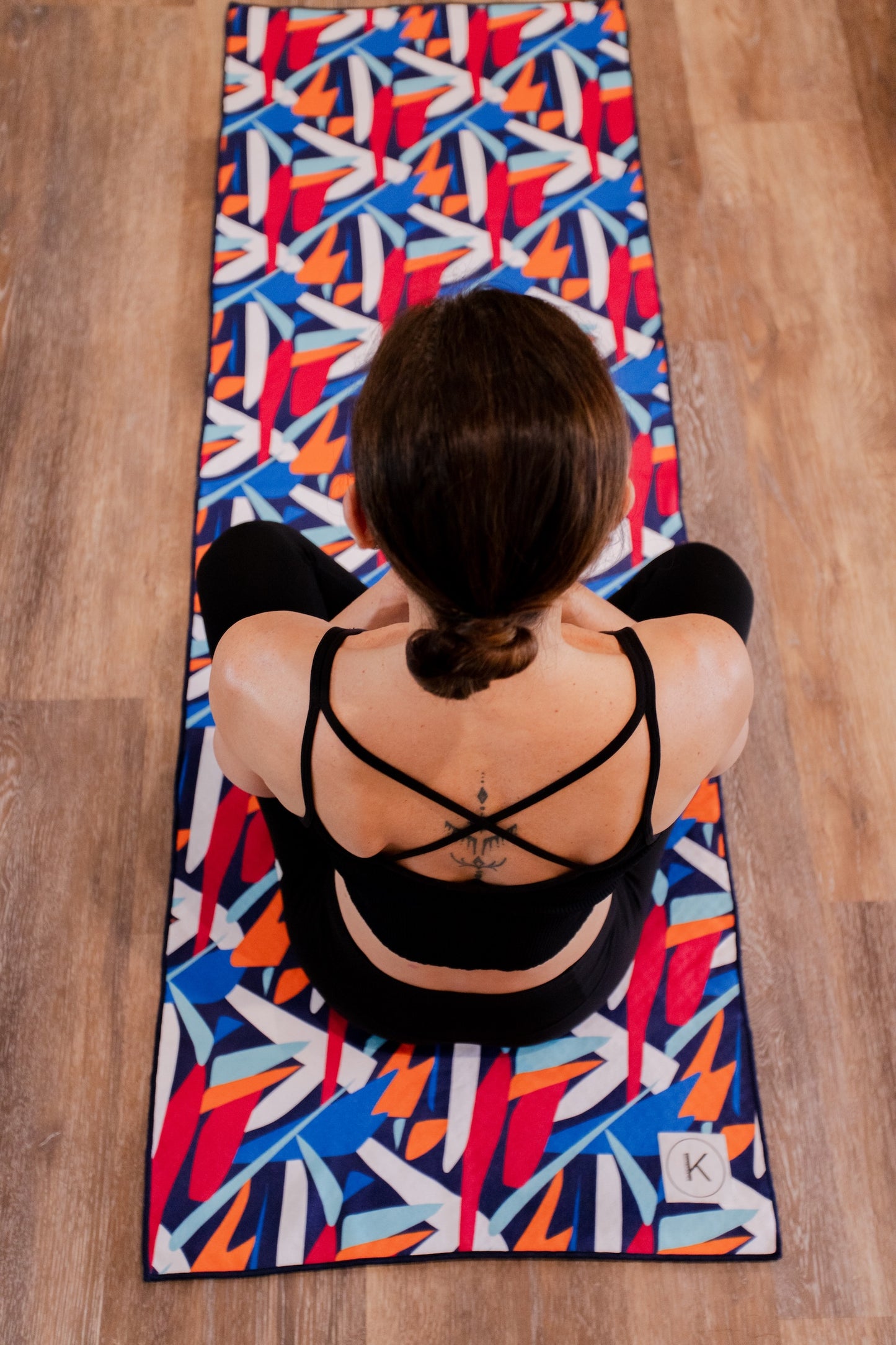 Kaleidoscope yoga towels in vibrant prints for men and women, perfect for hot yoga sessions