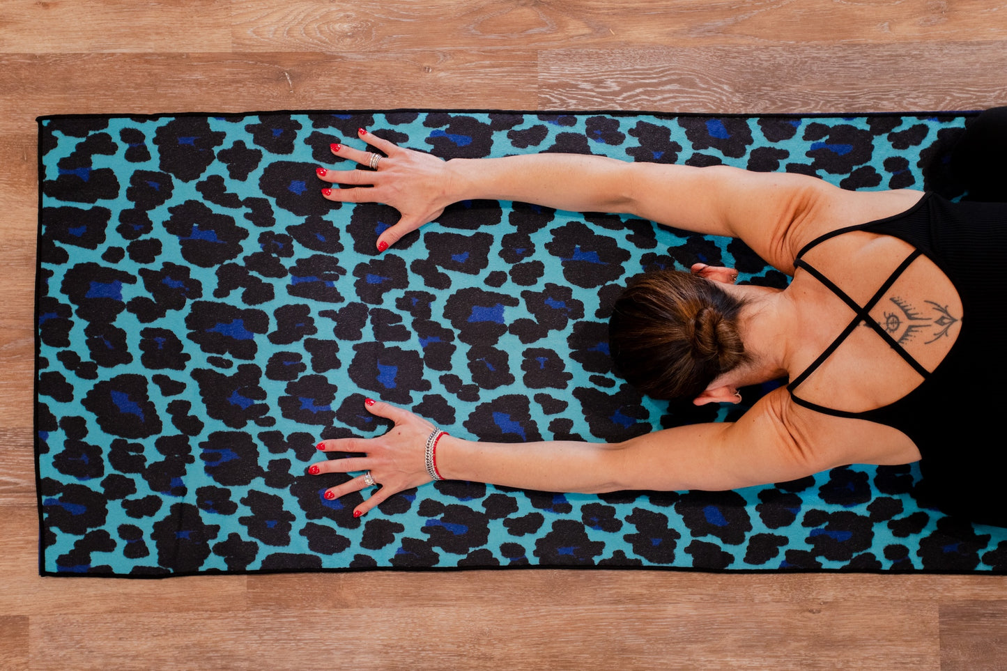 Kaleidoscope yoga towels in vibrant prints for men and women, perfect for hot yoga sessions