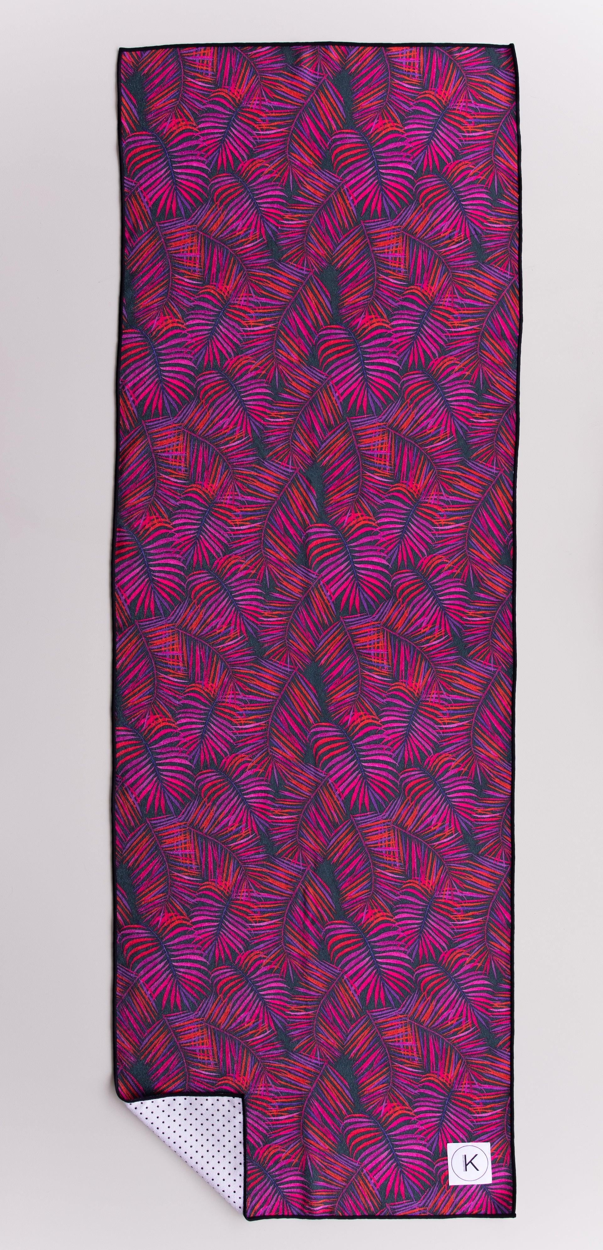 Eco-friendly kaleidoscope yoga towels with bold prints for men and women practicing hot yoga.