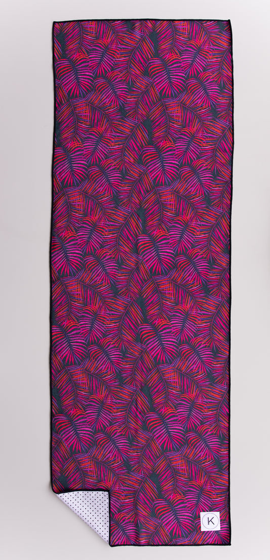 Eco-friendly kaleidoscope yoga towels with bold prints for men and women practicing hot yoga.