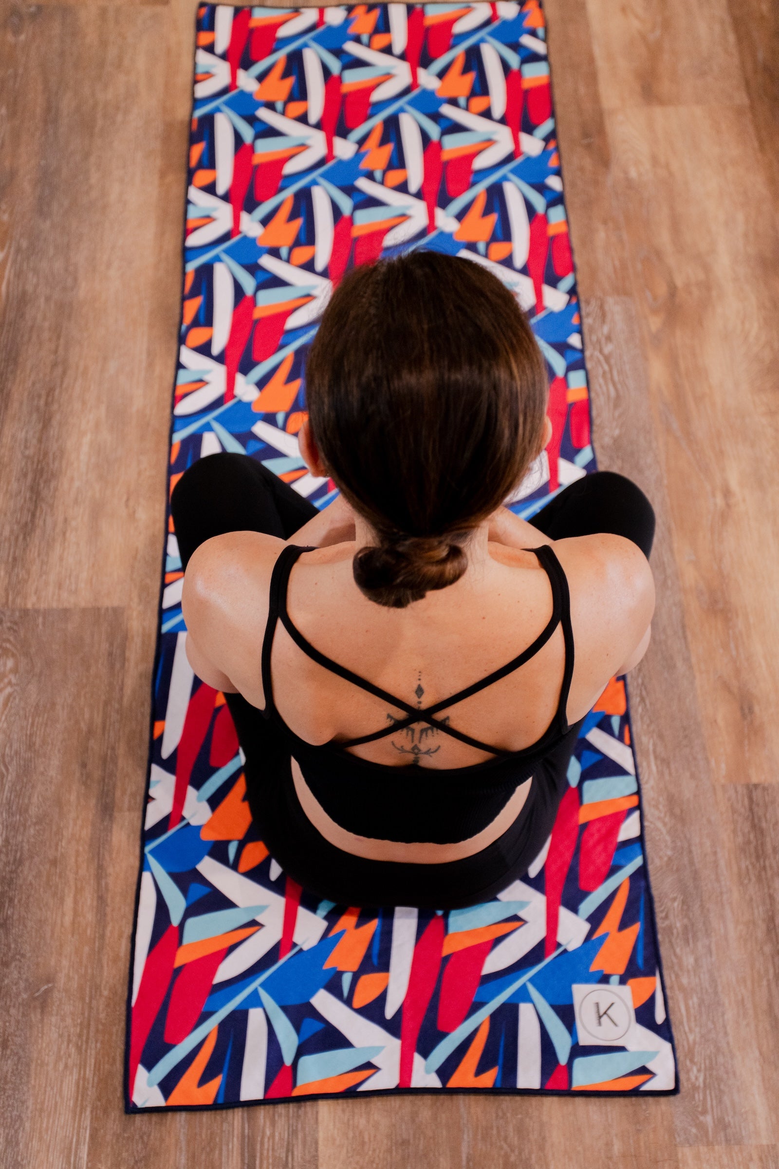 Kaleidoscope yoga towels in vibrant prints for men and women, perfect for hot yoga sessions